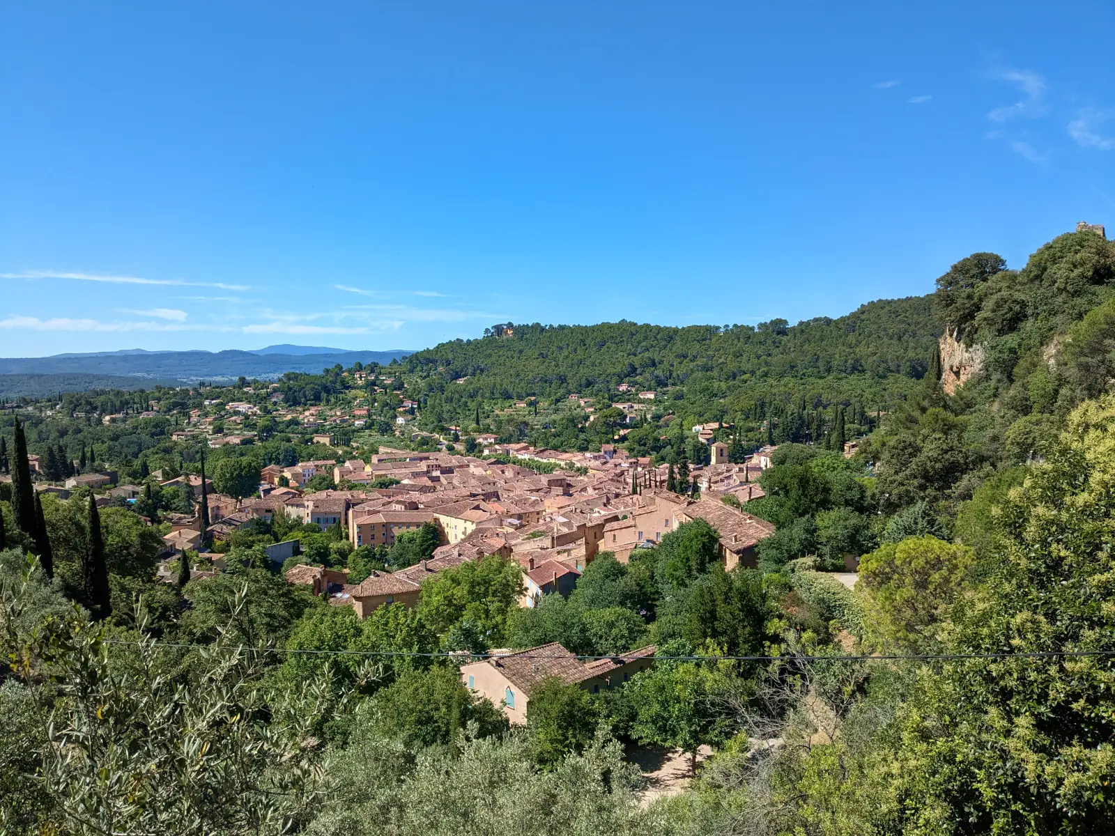 A general view of Cotignac at the foot of the cliff
