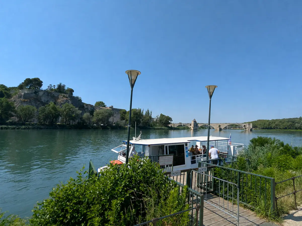 Barthelasse river shuttle with the Pont Saint-Bénézet in the background