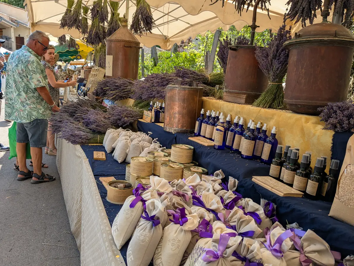 Bunches, flower sachets and bottles on a stall at the Ferrassières lavender festival