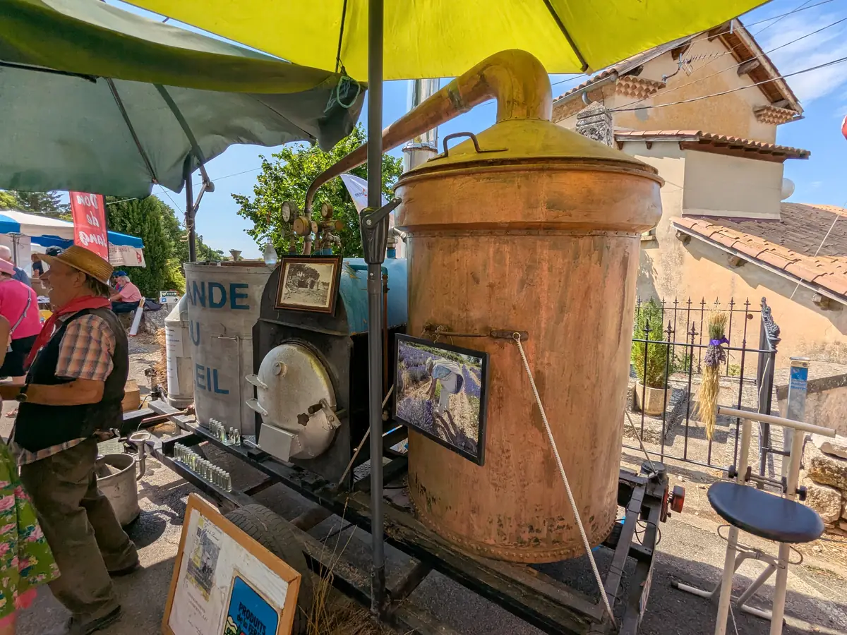 Copper still displayed at the Ferrassières lavender festival market