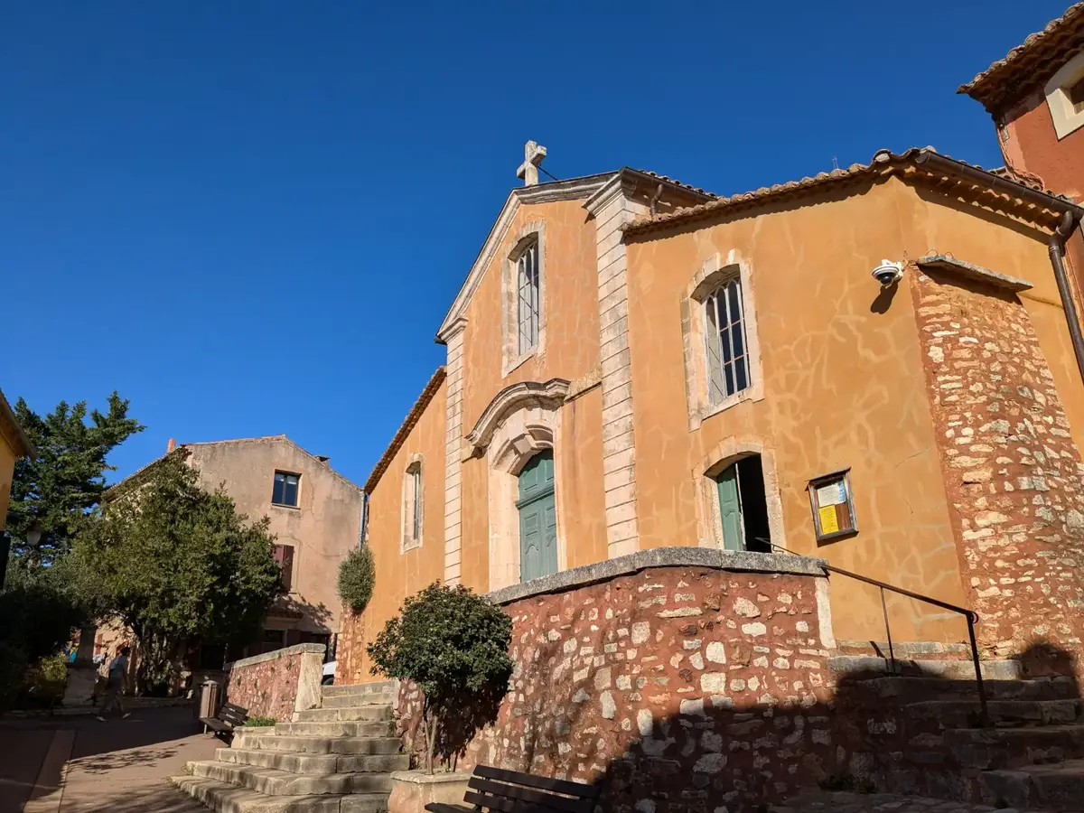 Ochre façade of Saint-Michel Church in Roussillon